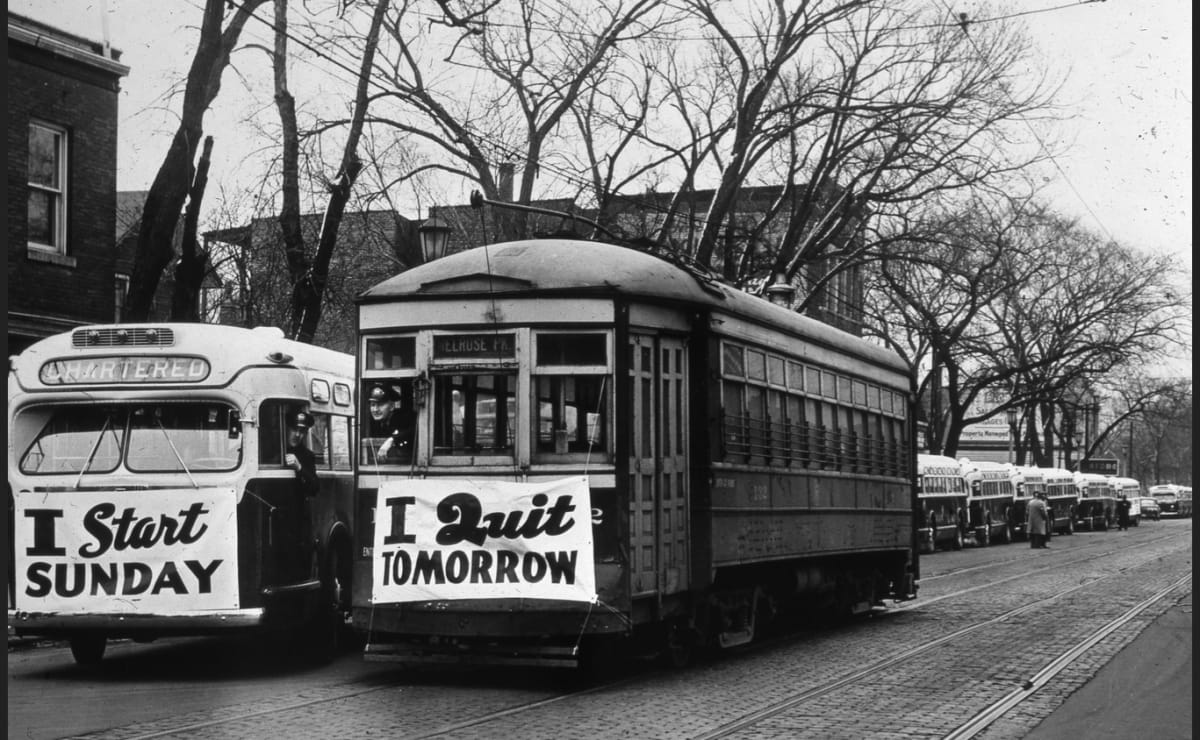 'I Start Sunday' 'I Quit Tomorrow'. This image shows the transition from Trolley service to bus service. Chicago, 1948.