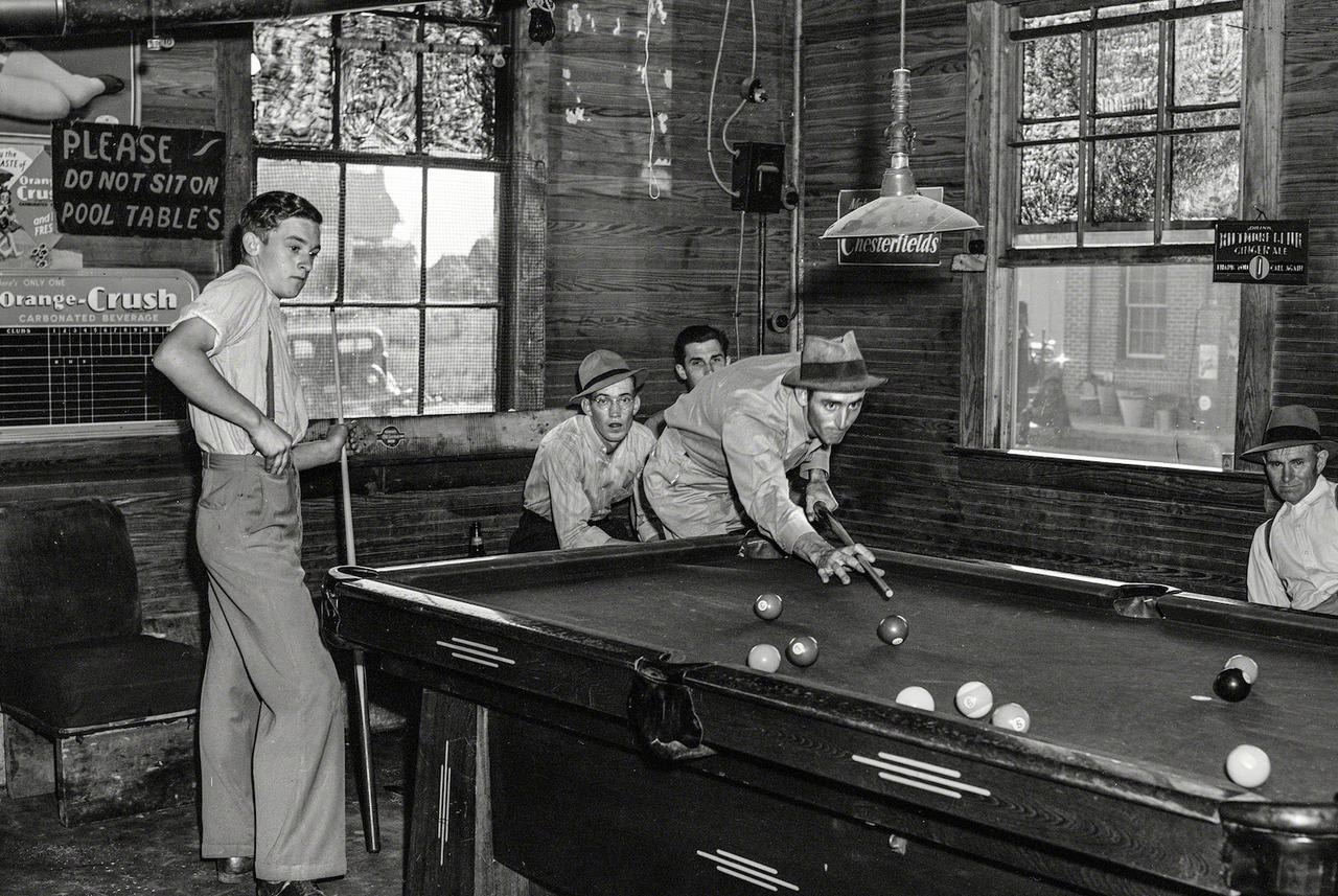 Playing pool at the general store. Photograph taken in Granville County, North Carolina by Jack Delano in 1940.