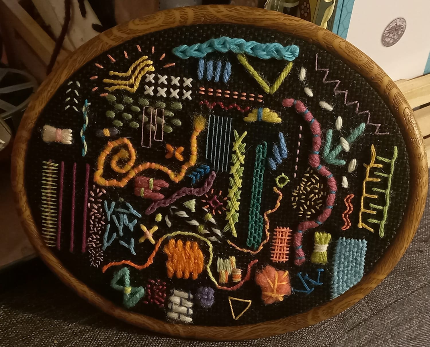 I make these colorful abstract embroideries and hang them everywhere