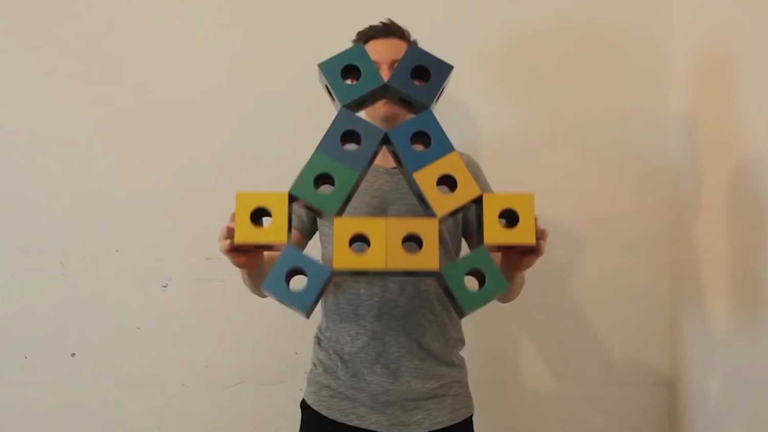 These are "Abercubes" by Erik Aberg. It's a system of cubes that can fold/unfold, transform into interesting shapes and create unique movements!