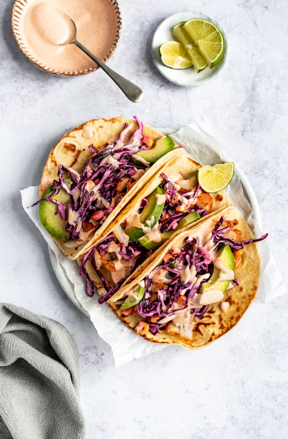 Best Ever Fish Tacos Made with Seasoned Cod, Corn Slaw & Creamy Sauce