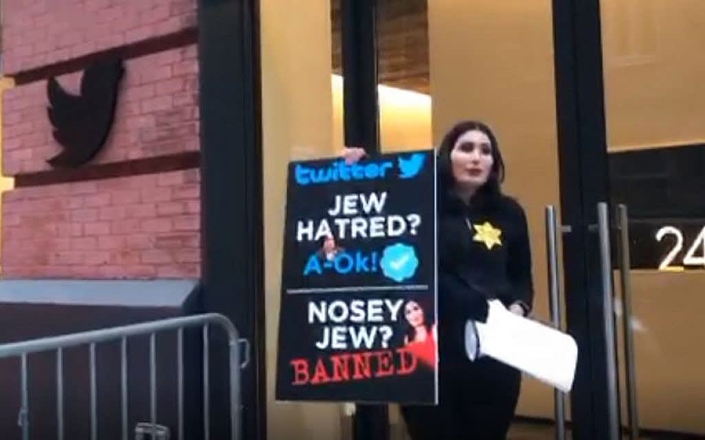 Wearing yellow star, banned far-right activist cuffs self to Twitter office