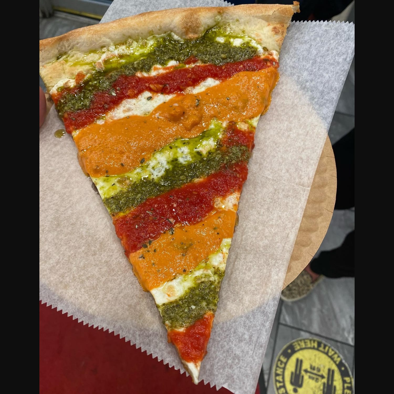 Marinara, vodka, pesto pizza NYC slice