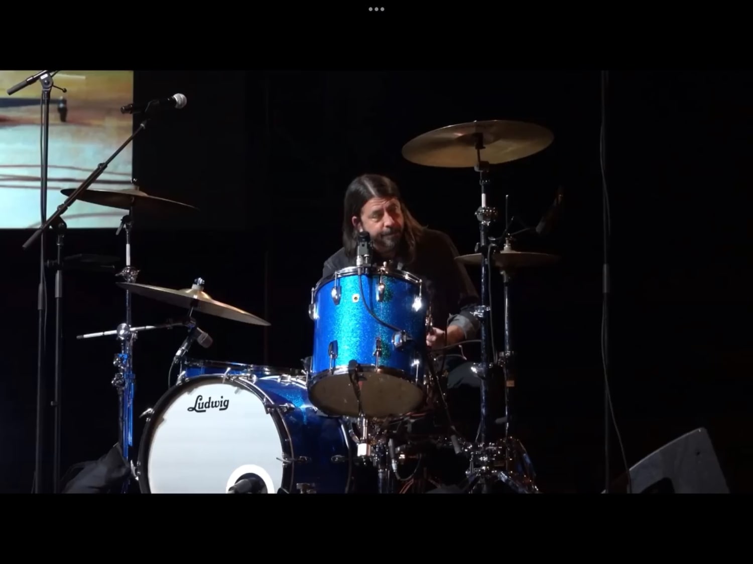 This is Dave Grohl at 52, drumming over the original track to *Smells Like Teen Spirit*, almost 30 years after his last performance with Nirvana (Ford Theater, 10/12/2021)