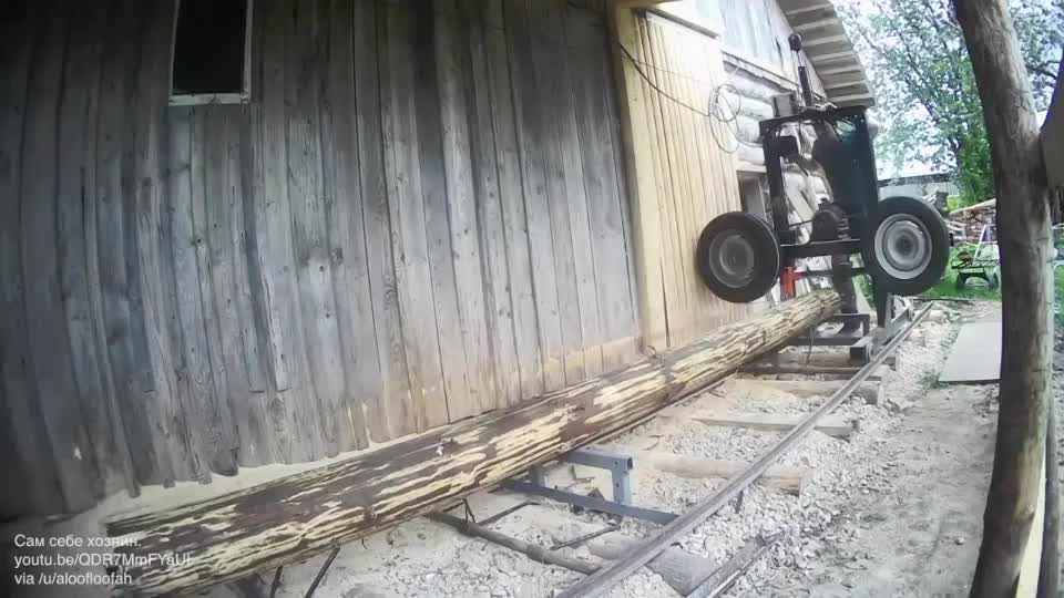 Homemade bandsaw mill from old car wheels