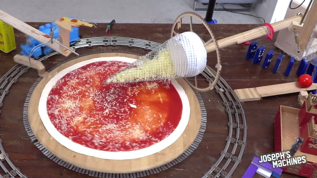A Clever Pizza Making Machine Powered by a Toy Train
