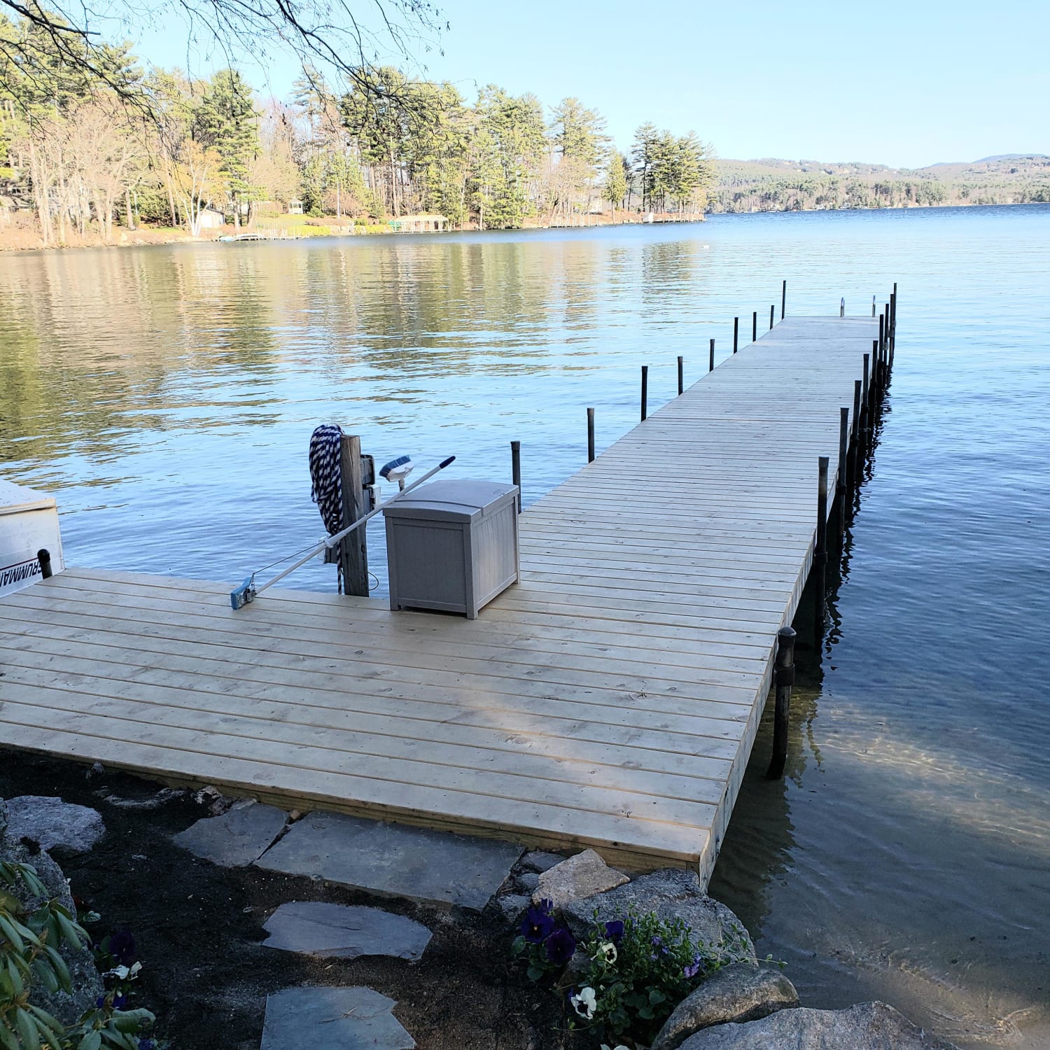 An ice dam destroyed my dock in January so i had to rebuild. Its not perfect and took me about 3 full weeks to get here. No real experience woodworking at all but needless to say I am pretty happy how it all turned out.