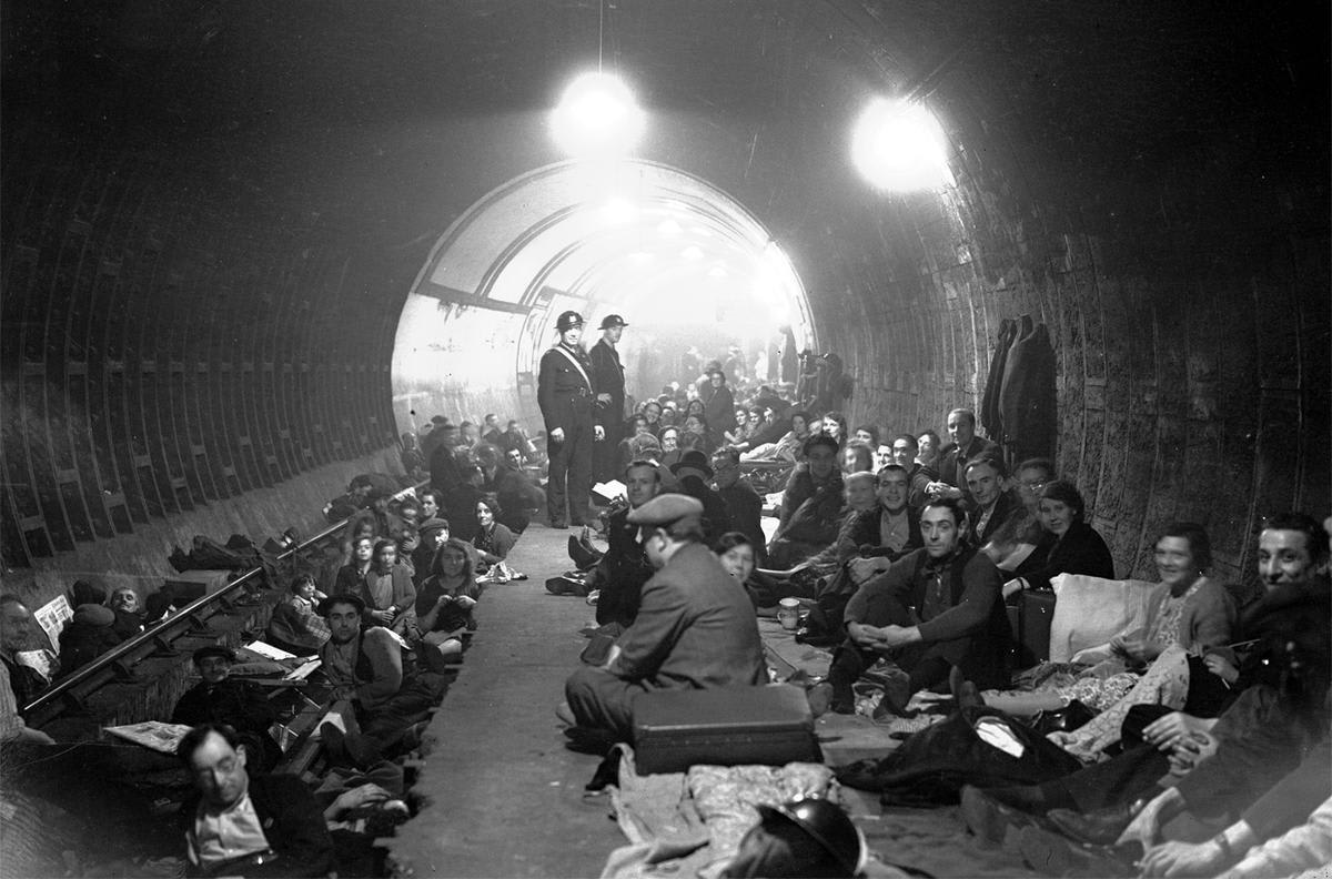 Londoners taking shelter in an underground train tunnel during an air raid. London, England, 8 Oct 1940.[1,