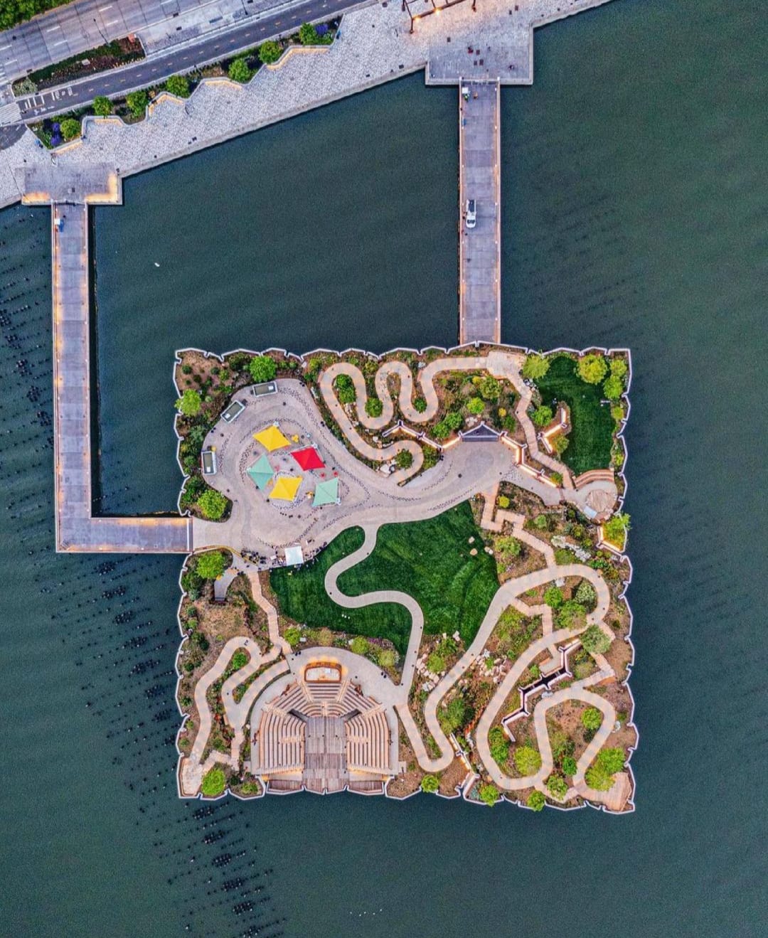 The newly opened Little Island is a free public park in Manhattan, New York City that is perched above the Hudson river on 132 concrete 'tulips'.