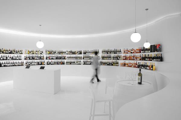 Porto Architects designs all-white interior for wine concept store in Portugal