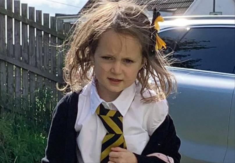 Hilarious Photos Show First Day At School Taking Its Toll On Little Girl