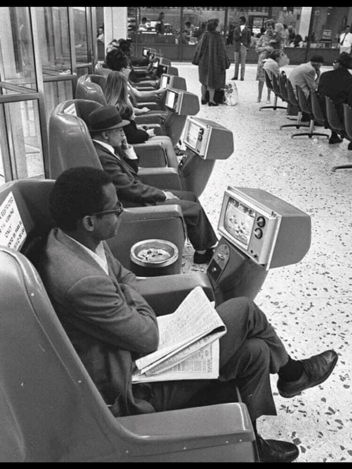 Passengers watching coin-operated TV’s in the LA Greyhound terminal in 1969.