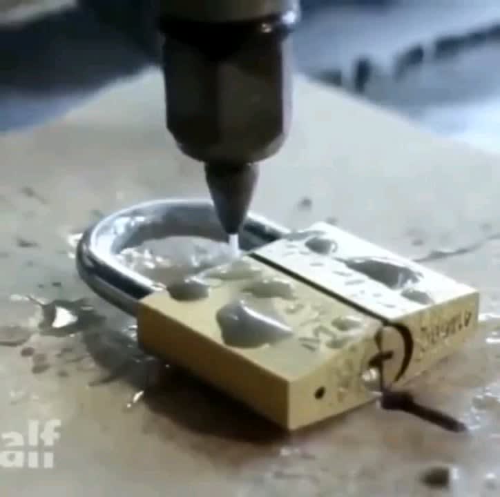 A water jet cutter at 9000 PSI