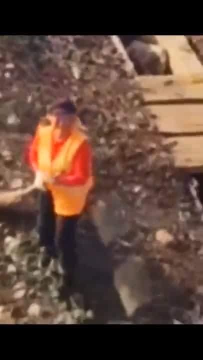 Helicopter pilot spots man sweeping floor, so decides to help out!