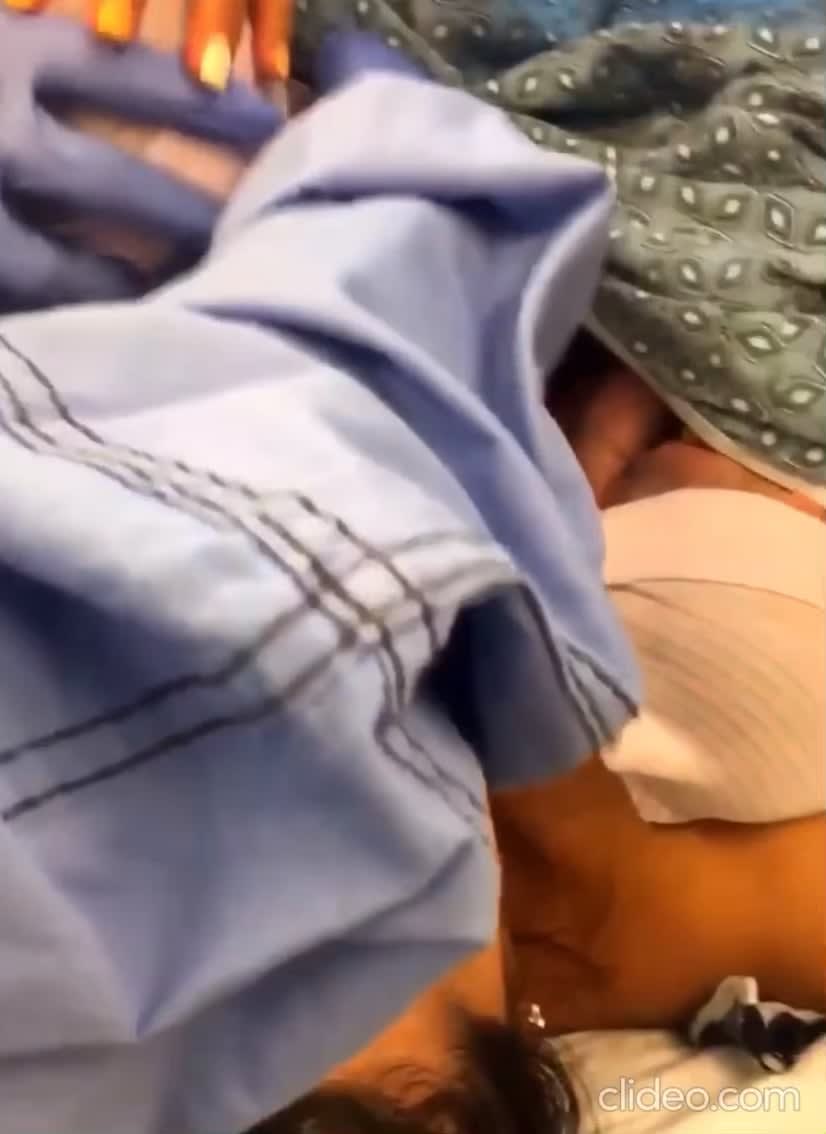 Two sisters holding hands after birth
