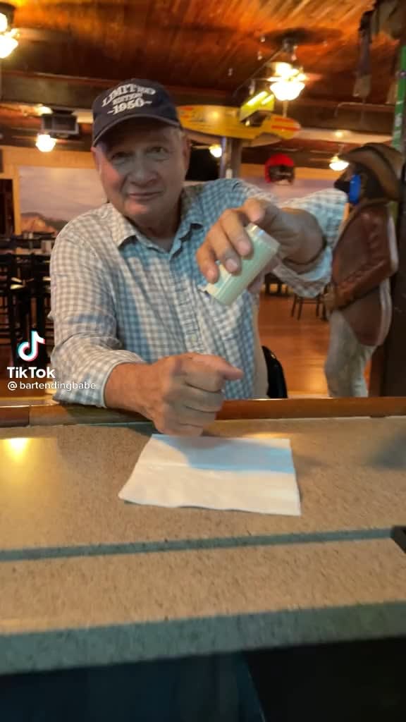 Older gentleman at a bar is super smooth with a magic trick