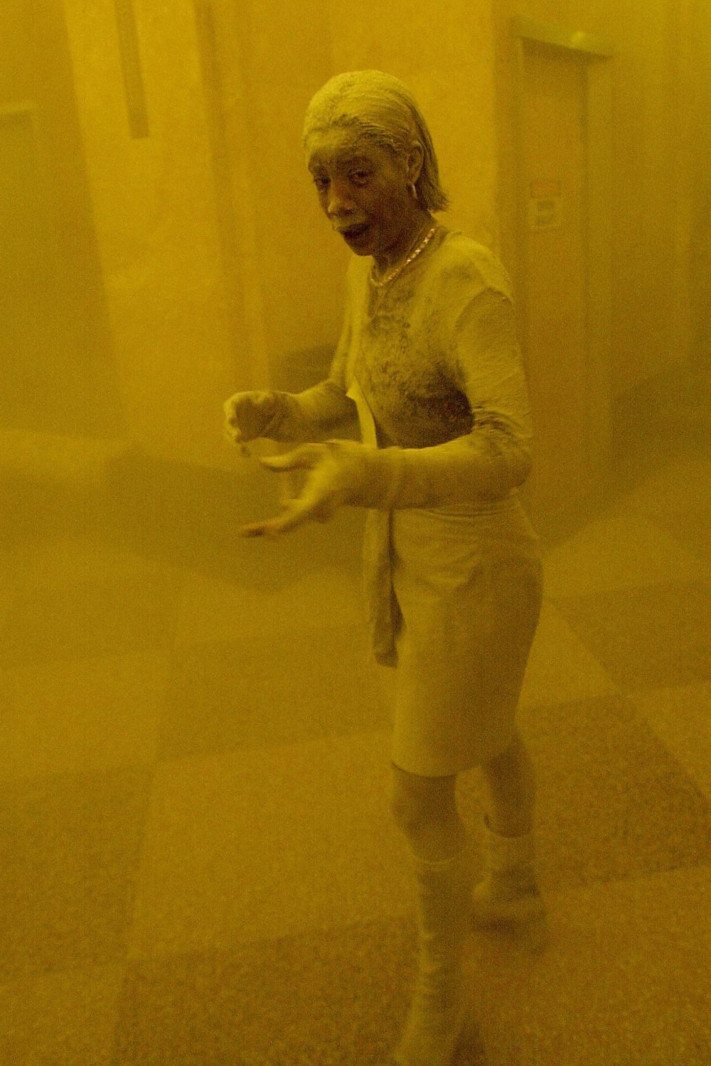 28-year-old Marcy Borders, who worked at the Bank of America located in the World Trade Center and survived its collapse, is photographed completely covered in dust. September 11 2001
