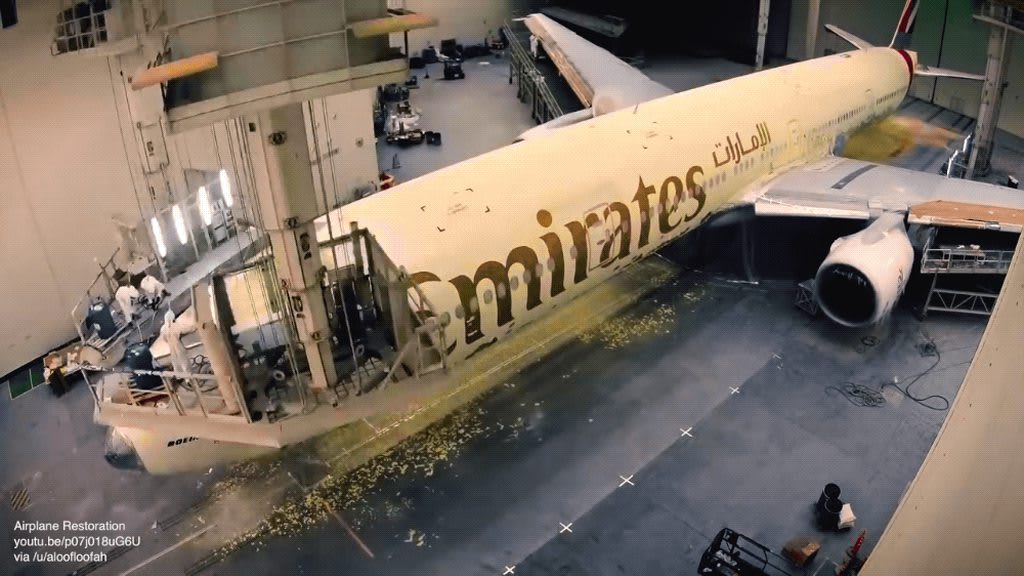 Oddly satisfying - Strip and repaint on an Emirates 777-300