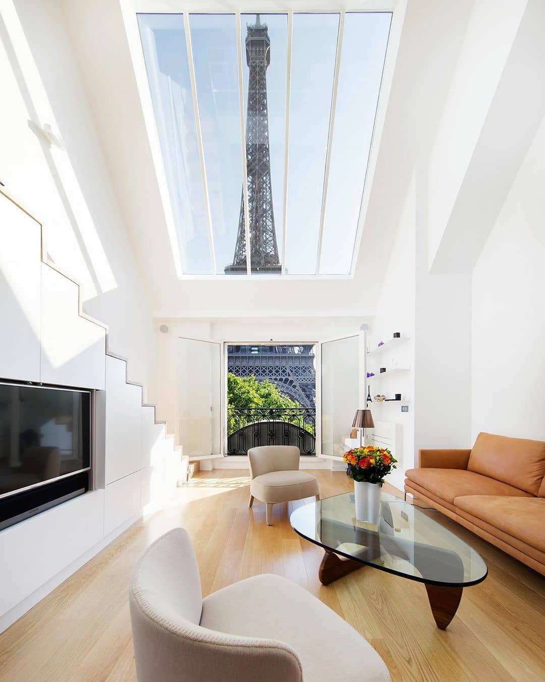 The 'Alexandra et Pascal' is an apartment with mesmerizing views of the Eiffel Tower, Paris, France by Agence Charlotte Féquet