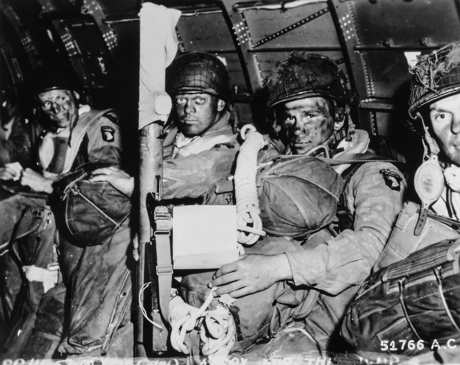 US paratroopers reading Eisenhower's message of good luck just before they took off for the initial assault of D-Day on 6th June 1944