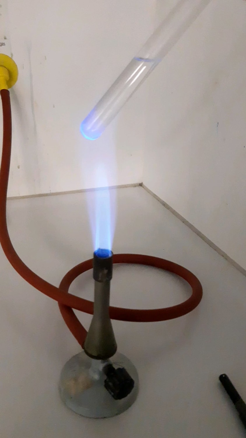 Proof of Sn ions by blue luminescence on the outside of the test tube.