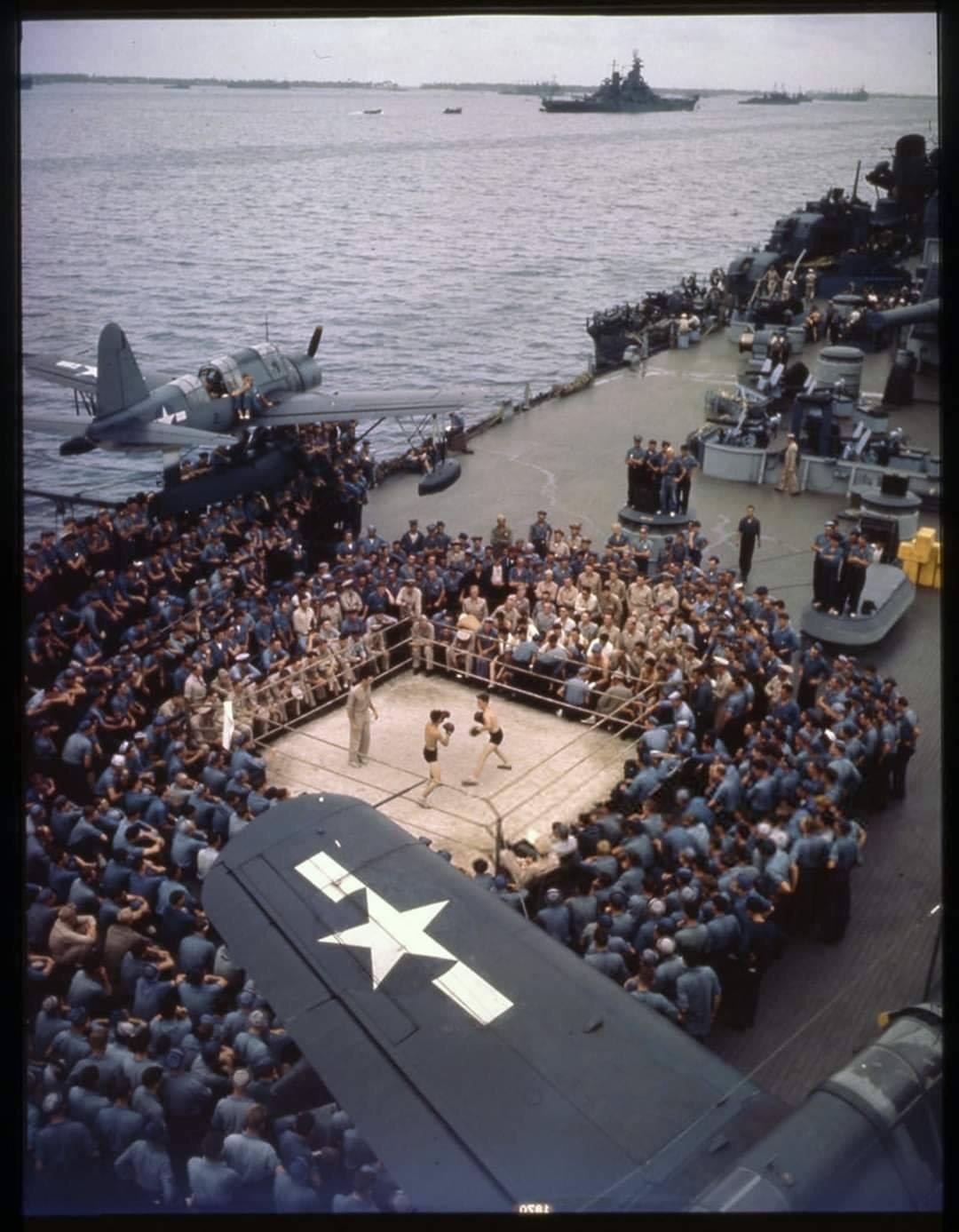 A boxing match on the quarterdeck of USS Iowa while the ship was in port awaiting the Marianas campaign, June 1944. (original color photo)