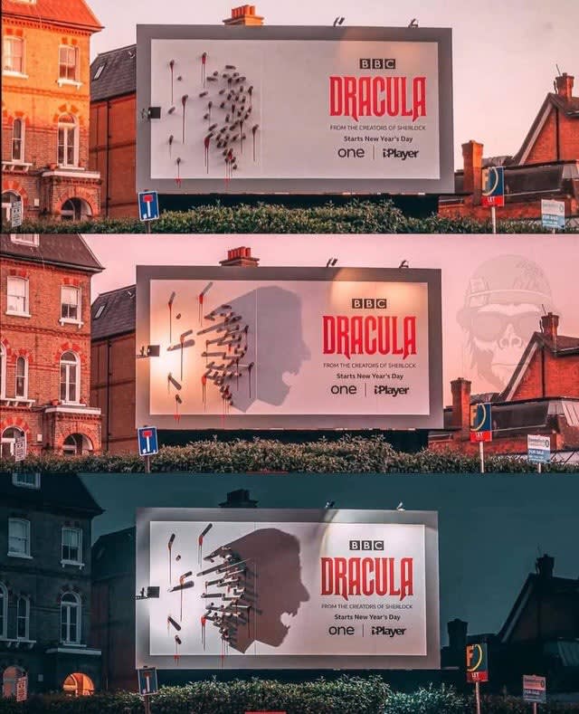 This billboard for "Dracula" has a bunch of stakes in it, which gradually -- as the sun goes down -- cast a shadow in the shape of Dracula himself.
