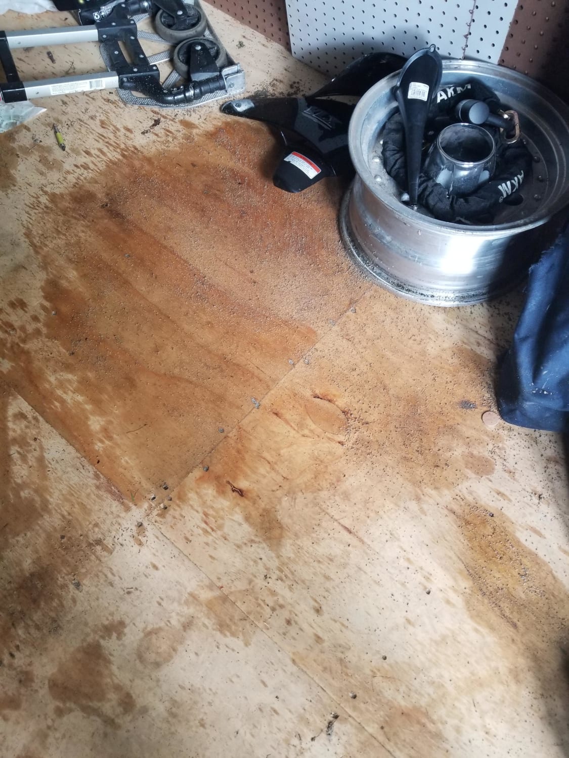 Dropped a qt of oil and it spilled all over my brand new wood floors of my shed. Used kitty litter to get the majority of it, any advice to clean up the rest?