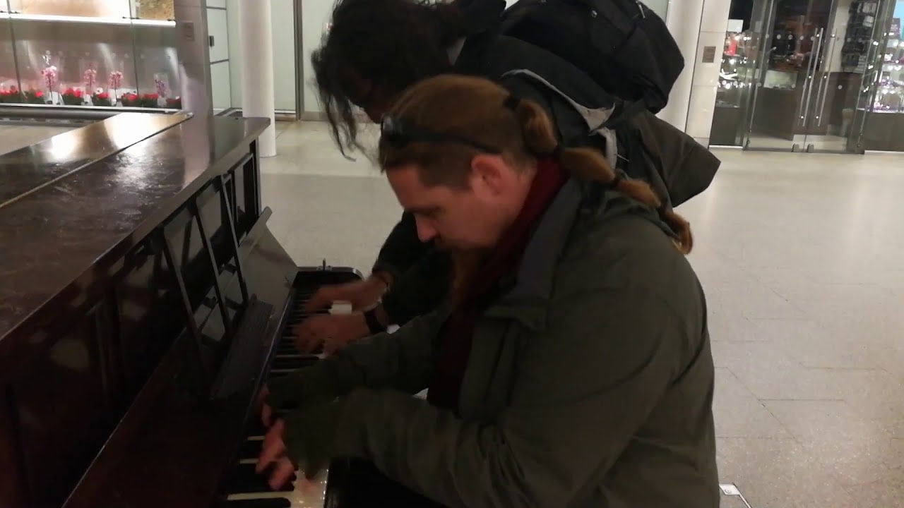 Steve and Noah playing a piano at St Pancras Station #TimstunesatCutetimster