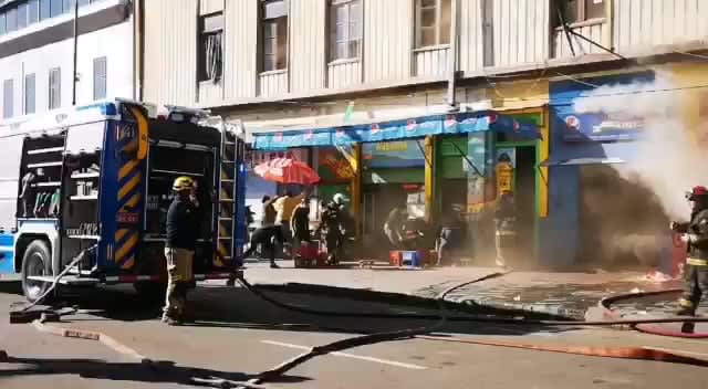 Building on fire explodes. Valparaiso, Chile
