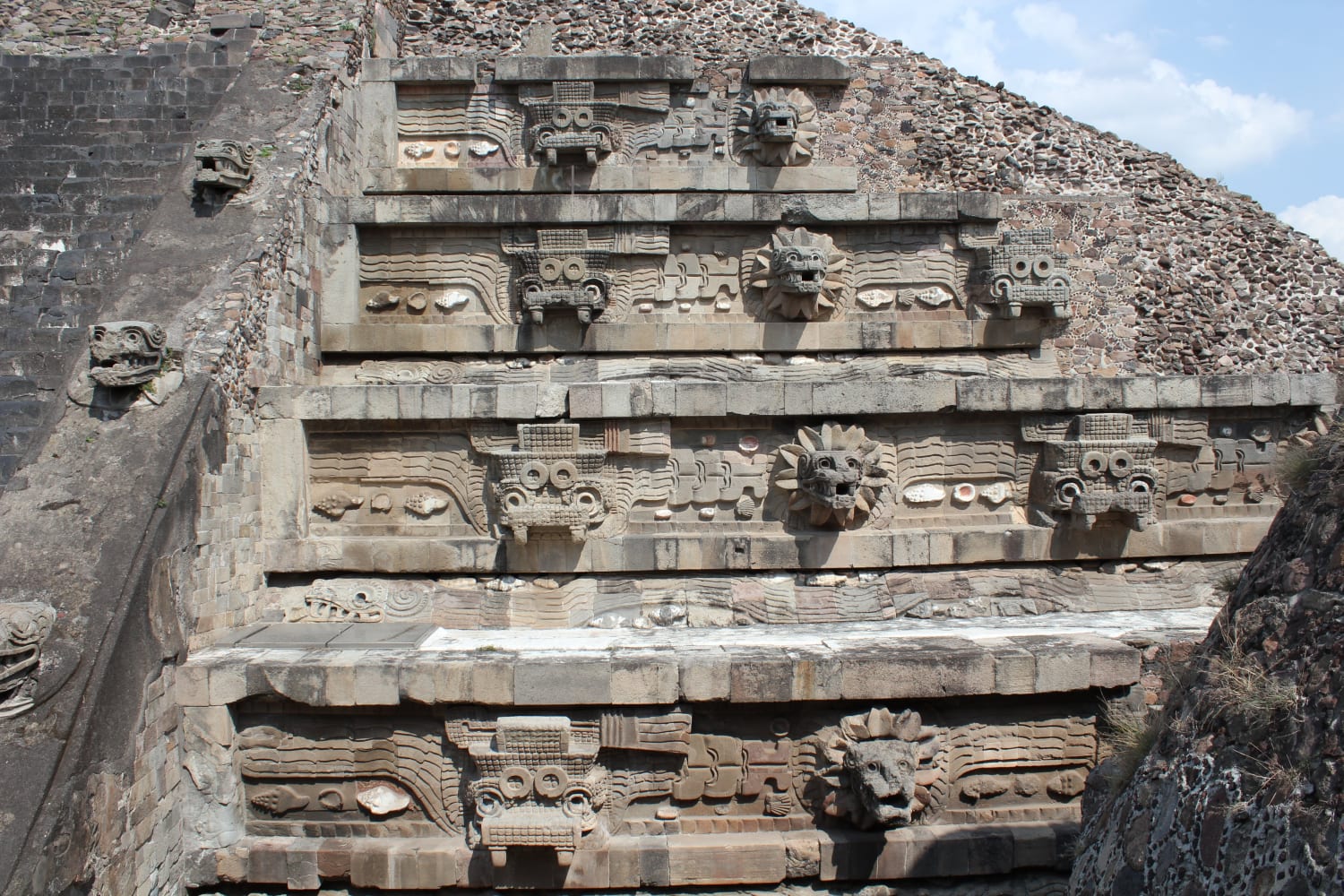 Carved details on the Temple of the Feathered Serpent at Teotihuacan depicting Quetzacoatl and another figure, possibly Tlaloc. Valley of Mexico, c. 150-200 CE