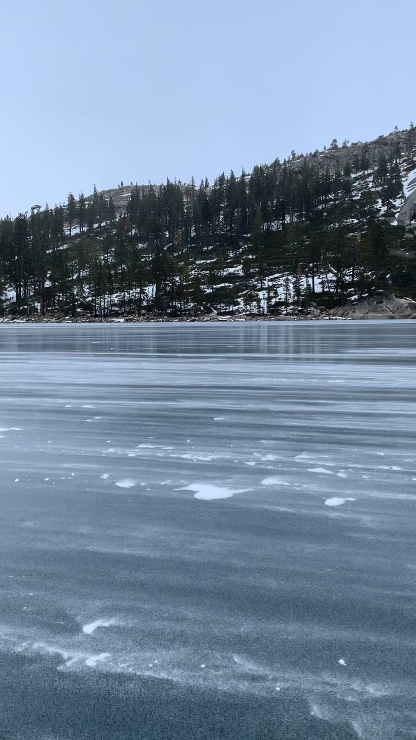 Snow blowing across a frozen lake in Tahoe