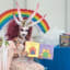 Photo of drag queen with horns reading to kids at Michelle Obama Neighborhood Library goes viral