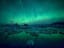 The aurora borealis reflecting off an Icelandic lagoon.