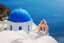 Why are buildings in the Cyclades painted blue and white in Greece?