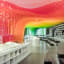 A Cascading Metal Rainbow Fills a Bookstore in Suzhou, China with Layers of Transparent Hues