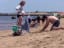 This guy dug a hole in the sand so his pregnant partner could lie in her stomach