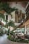 Sunken living room under a high vaulted ceiling surrounded by the tropical greenery of Bali, Indonesia