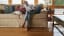 Woman Fulfills Manifest Destiny Of Hardwood Floor Throughout Home