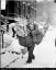 Postman delivering Christmas joy, Chicago, 1929.