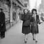 Marge Stuart, left and Claire Shields walk along Madison Avenue puffing on their newly acquired pipes in New York, Dec. 27, 1944. Photo Robert Kradin
