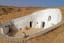A traditional medieval cave house with a courtyard found in the desert of Libya.