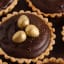 Chocolate and Salted Caramel Tarts with Hazelnut Pastry