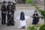 A nun in Myanmar kneeled in front of police begging them not to attack protesters: "Kill me instead." Police shot at protesters anyway, killing at least 2. She said she saw a "young kid's head had exploded and... a river of blood on the street." (Photo: Myitkyina News Journal)