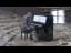 Guy plays a piano in an abandoned cinema that has been overrun with wild macaque monkeys.