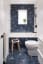 Bathroom with blue starbursts and white subway tile in a makeover of a century-old Edwardian townhouse - Toronto Canada - designed by AAmp Studio