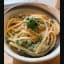Linguini & sautéed peas tossed in vegan garlic alfredo sauce and topped with Follow Your Heart parm & fresh parsley