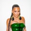 Kim Kardashian Shows Off "Six Pack" With Daring Green Look at Her Family's Private Christmas Celebration