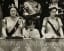 A young Prince Charles standing between his grandmother, The Queen Mother, and aunt, Princess Margaret, at his mother Queen Elizabeth's coronation in 1953