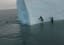 Watch an Iceberg Roll on Experienced Ice Climbers